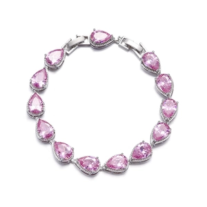 Close-up of pink pear-cut AAA zircon bracelet in silver setting for weddings