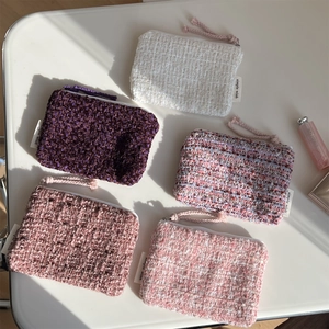 Set of five woven tweed mini pouches in purple and pink tones with zipper closure