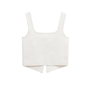 Detailed view of white knit crop top featuring a square neckline and geometric hem detail