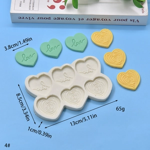 Silicone mold with 6 cavities featuring Love hearts and swirl designs for DIY baking
