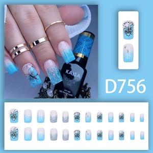 Blue gradient press-on nails with butterfly motifs, glitter, and rhinestones set