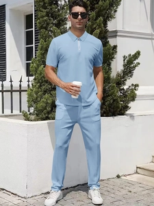 Detail of light blue men's summer set featuring a zippered polo shirt and casual trousers