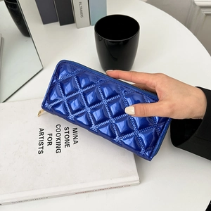 Glossy blue patent leather zip-around wallet with diamond quilted pattern for women