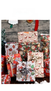 Macro view of Christmas wrapping paper featuring Santa, reindeer, and festive ribbons