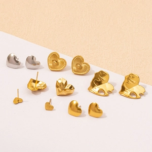 Close-up of assorted heart-shaped 304 stainless steel earrings in gold and silver finishes