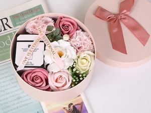 Pink gift box with scented soap roses and candles for Valentine's Day present