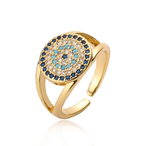 Golden Evil Eye open ring featuring blue and white zircon stones on a white background