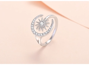 Macro detail of sun and moon ring with cubic zirconia inlay and adjustable open band