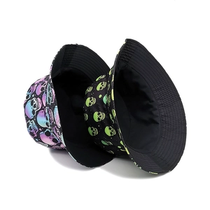Double-sided bucket hat with creative skull prints in green and purple neon colors