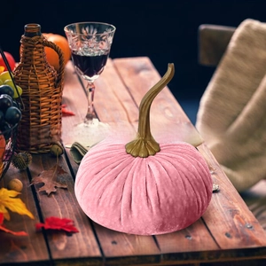 Pink velvet pumpkin centerpiece for Thanksgiving with rustic stem and autumn leaves decor
