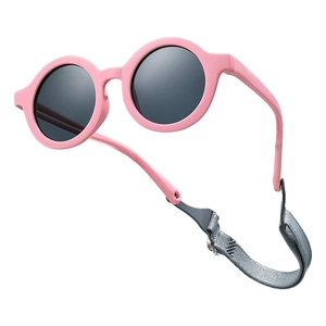 Pink round baby polarized sunglasses with adjustable grey elastic strap and matte frame