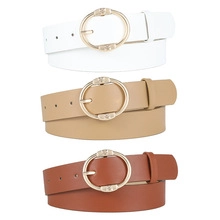 Three minimalist leather belts in white, khaki, and brown with gold round metal buckles