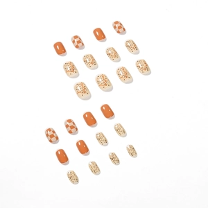 Autumn brown checkerboard press-on nails set in short square oval shape on white background