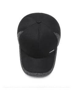 Top view of baseball cap showing grey tweed paneling and silver metal Sport badge