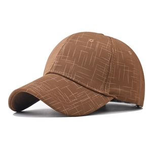 Brown baseball cap with linear grid texture and structured six-panel design on white background