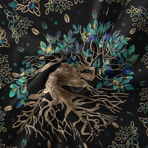 Detailed view of Tree of Life and Celtic knot pattern on soft draped black tapestry fabric