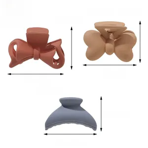 Detailed size view of matte claw clips in bow and curved designs with measurements