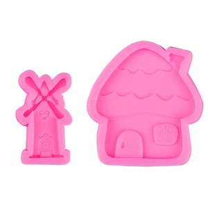 Pink silicone mold set featuring windmill and mushroom house shapes for cake decorating