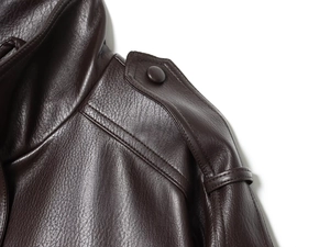 Detail of shoulder and collar on deep brown faux leather jacket with fine stitching