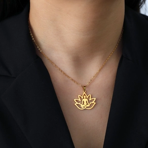 Golden yoga lotus necklace with meditation figure pendant on elegant model