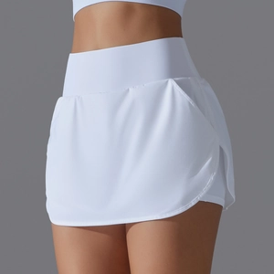 Detail of white high-waisted tennis skort showing side split and inner lining layer