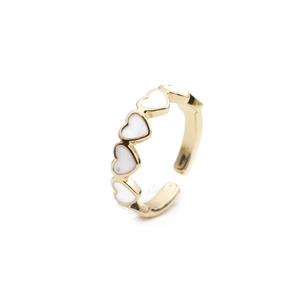Detail of adjustable gold ring with five white enamel hearts in a row for women