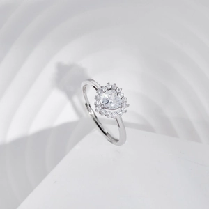 Macro shot of S925 sterling silver heart ring showing the purity hallmark engraving