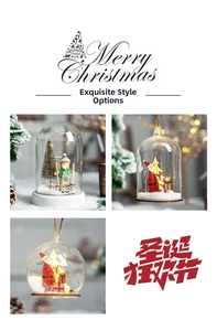 Close-up of three LED Christmas glass globes with Santa figures and XMAS letters