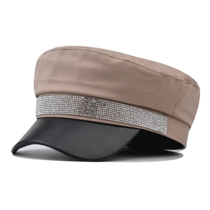 Close-up of khaki twill cotton army hat featuring a black leather brim and rhinestone band