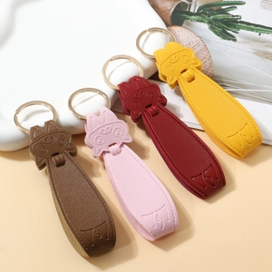 Minimalist PU leather pig keychains in four colors with premium gold metal rings