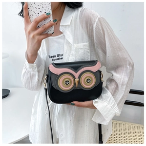 Detail view of owl motif PU leather crossbody bag featuring colorful rhinestone accents