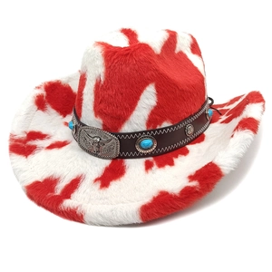 Top view of a cow print cowboy hat with a brown leather band and bull head metal buckle
