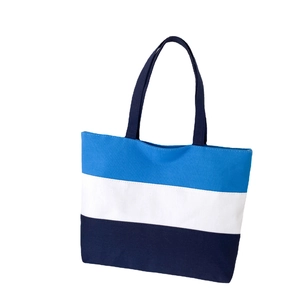 Three-color patchwork canvas tote bag in blue white and black with minimalist style