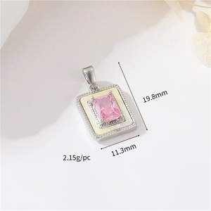 Detail shot of vintage silver pendant with pink stone and white shell, 19.8x11.3mm