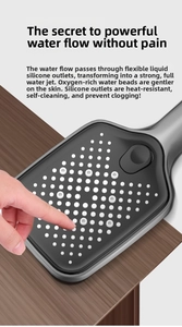 Detail of square shower head showing flexible silicone nozzles for easy self-cleaning