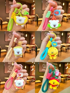Collection of six cute cartoon puppy keychains with fruit and food headgear themes