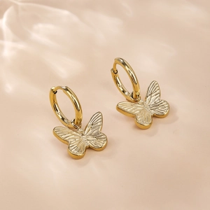 Elegant gold butterfly dangle earrings with detailed wing texture and hoop closure