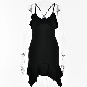 Detail of black V-neck mini dress showing ruffled hemline and 3D floral accents