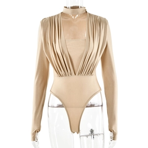 Detail view of champagne V-neck long sleeve bodysuit with pleated fabric and glossy finish