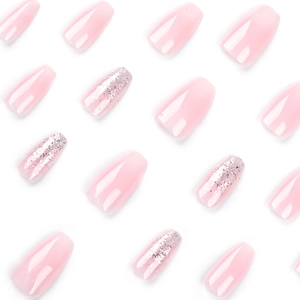 Pink gradient press-on nails with silver glitter accent for natural manicures