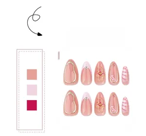 Detail of pink press-on nails with crocodile pattern, 3D flowers and golden edges