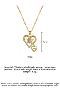 Macro shot of double heart pendant with sunburst texture and pave zircon on gold chain