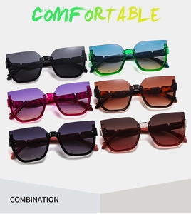 Flat lay of retro cat-eye sunglasses collection with gradient lenses in various colors