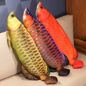 Detailed view of lifelike fish plush pillows with realistic scale patterns on a sofa