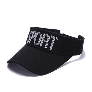 Detail of white SPORT embroidery on black cotton fabric of an open top sun visor hat