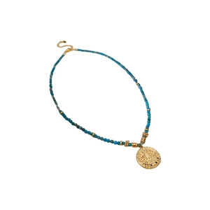 Ethnic style blue beaded necklace with a golden round eye totem pendant for women