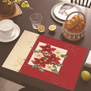 Detailed view of Christmas poinsettia placemat on a wooden table with festive decor