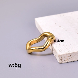 Minimalist wavy twisted gold stainless steel ring 0.4cm width on stone display
