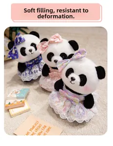 Detailed view of three panda plush toys in blue, pink, and purple princess dresses on soft rug