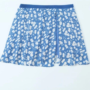 Jupe mi-longue bleue à fleurs avec fente latérale et taille élastique confortable